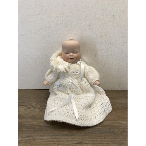 395 - A BMS four faced porcelain doll