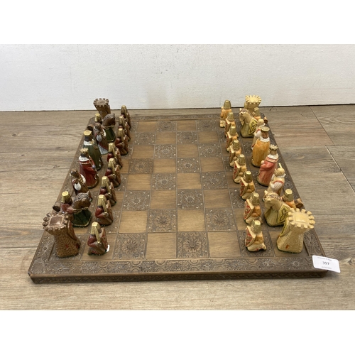 397 - A Jaques London chess set with carved hardwood board and hand painted resin pieces - board approx. 4... 