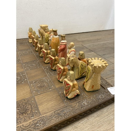 397 - A Jaques London chess set with carved hardwood board and hand painted resin pieces - board approx. 4... 