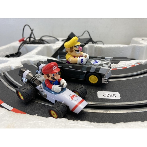 404 - A Carrera Go!!! Scalextric track set with two controllers and two matching Mario Kart slot cars