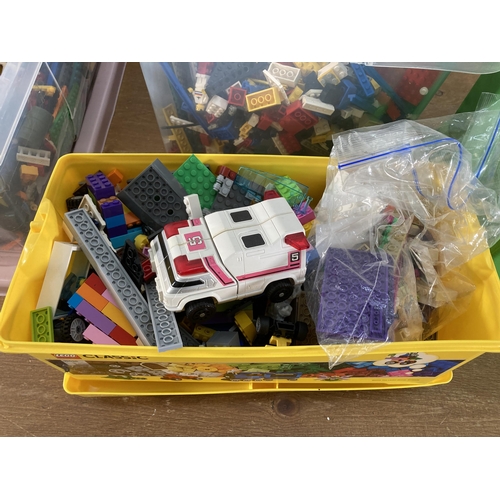 407 - Four boxes containing a large collection of assorted Lego