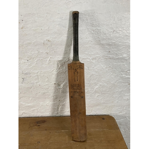 410 - A boxed Townsend Croquet Ltd The Garden Croquet Set together with a cricket bat