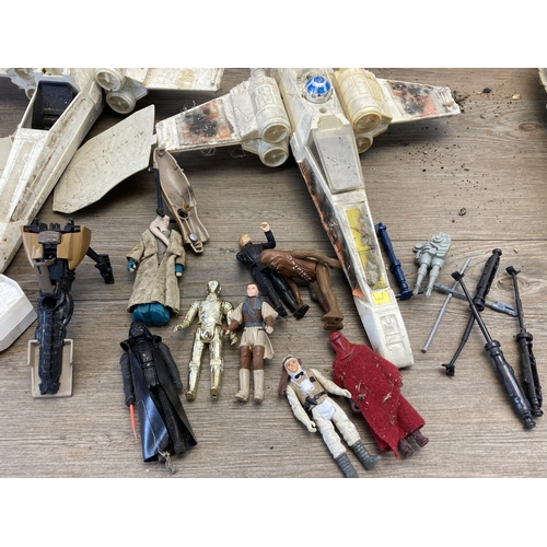 416 - A collection of vintage Star Wars figurines and Space crafts to include Chewbacca, L.F.L. C3PO, Kenn... 