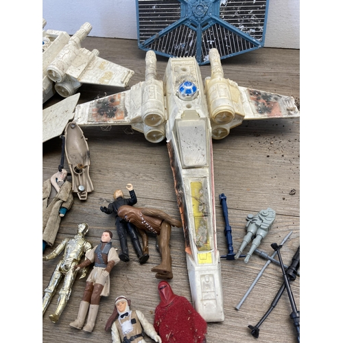 416 - A collection of vintage Star Wars figurines and Space crafts to include Chewbacca, L.F.L. C3PO, Kenn... 