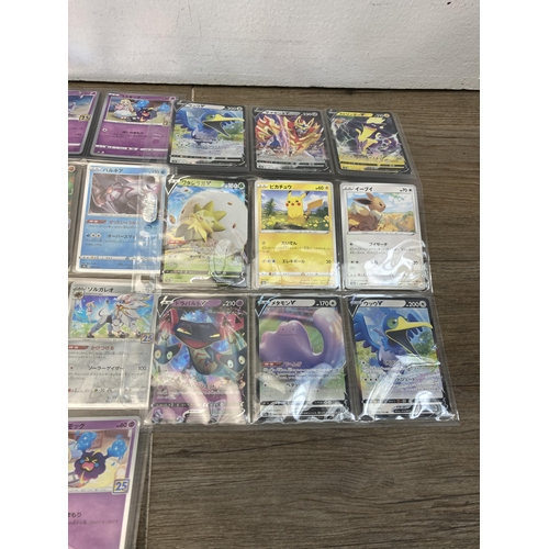 421 - A collection of Pokémon trading cards to include Japanese 25th Anniversary, Japanese Shiny Star V et... 