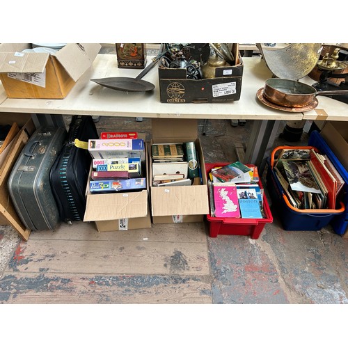 950 - Four boxes and two vintage travel cases containing vintage board games, four vintage Enid Blyton boo... 