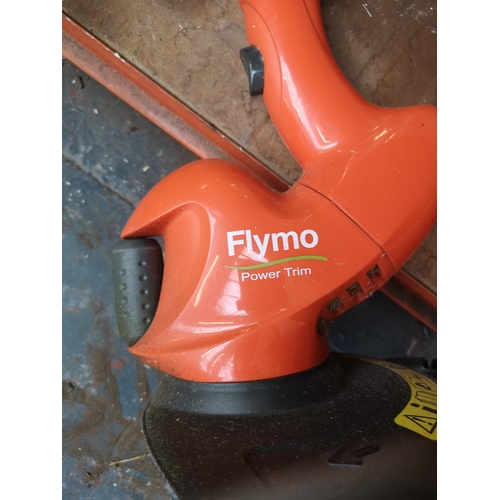 799 - Two Flymo 240v garden tools, one garden vac and one Power Trim strimmer