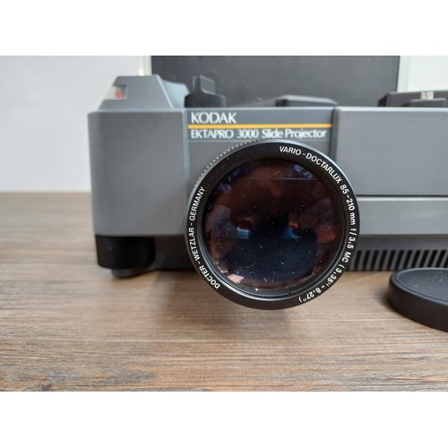 569 - A cased Kodak Ektapro 3000 slide projector fitted with with Docter Vario-Doctarlux lens with remote ... 