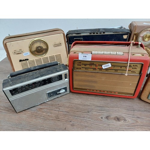 578 - Eight vintage portable radios to include Roberts R600, Nordmende etc.