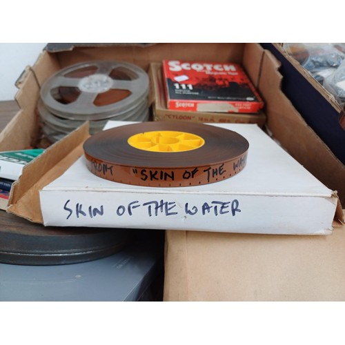 584 - Two boxes containing a large collection of reel-to-reel tapes with examples marked 'Skin of the Wate... 