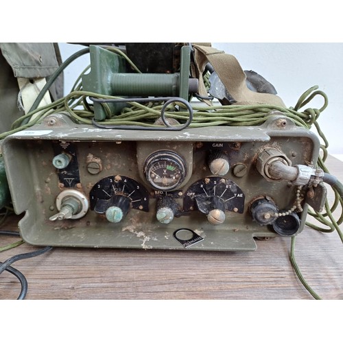 588 - A cased military HF-156 manpack wireless transceiver with accessories to include ADMY Patt. No. 7681... 