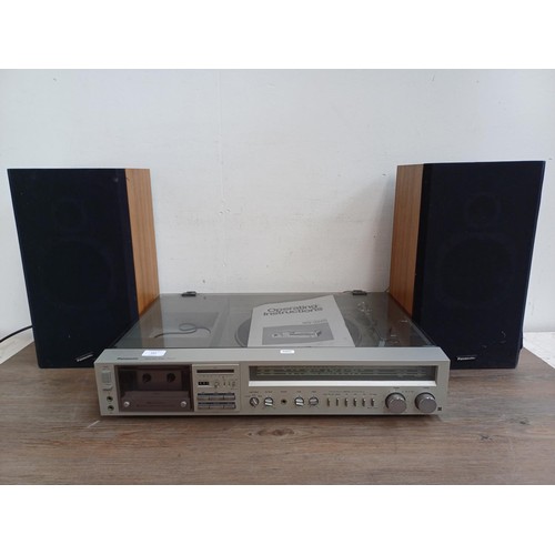 597 - A Panasonic SG-3220 stereo music centre comprising two speed turntable, Dolby cassette deck, three b... 