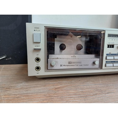 597 - A Panasonic SG-3220 stereo music centre comprising two speed turntable, Dolby cassette deck, three b... 