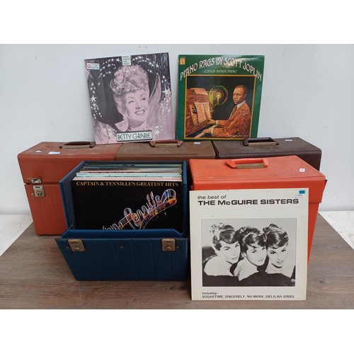 612 - Five record cases, one containing LP vinyl records to include The Bonzo Dog Band, Blondie, Nancy Sin... 