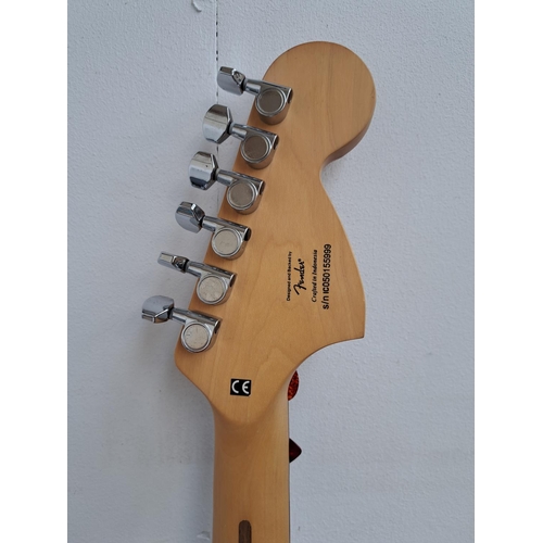 635 - Two items, one cased left handed 2005 Squier Stratocaster electric guitar with two electronic tuners... 