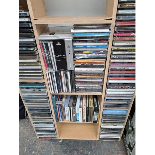 636 - A CD storage unit containing CDs to include Adele, Tracy Chapman, Coldplay, Fleetwood Mac, Eric Clap... 