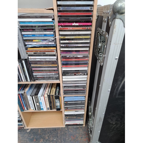 636 - A CD storage unit containing CDs to include Adele, Tracy Chapman, Coldplay, Fleetwood Mac, Eric Clap... 