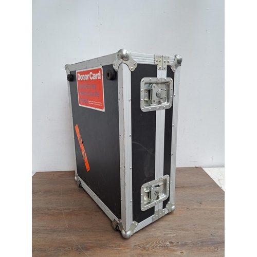 637 - An NSP foam lined flight case - approx. 73cm x 60cm x 30cm