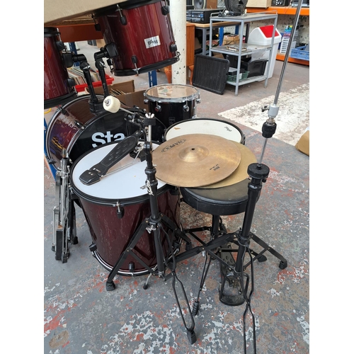 640 - A Stagg five piece drum kit comprising bass drum with pedal, two rack toms, floor tom, snare with st... 