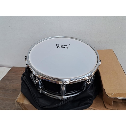 640 - A Stagg five piece drum kit comprising bass drum with pedal, two rack toms, floor tom, snare with st... 