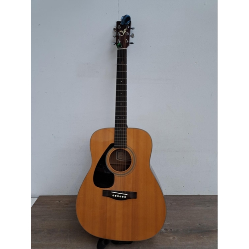 642 - A cased Yamaha FG-412L left handed dreadnought steel strung acoustic guitar with strap, Snark electr... 