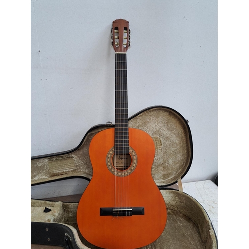 644 - A hard cased Epiphone C25 nylon strung full size classical guitar