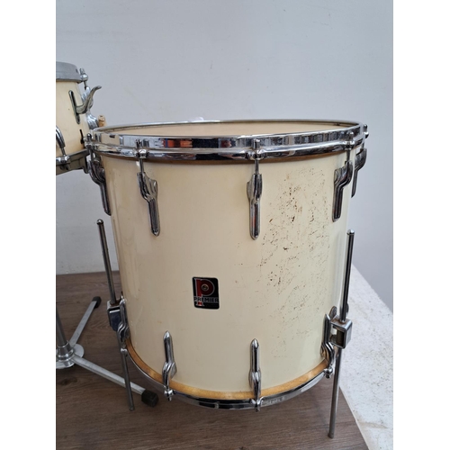 650 - A collection of vintage drum kit drums and percussion accessories to include wooden rimmed bass drum... 