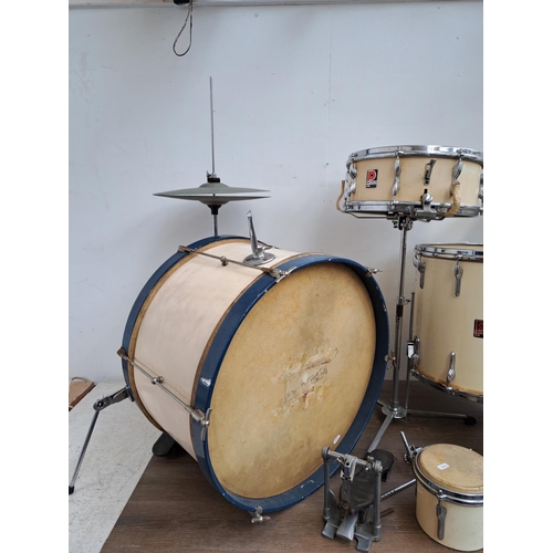 650 - A collection of vintage drum kit drums and percussion accessories to include wooden rimmed bass drum... 