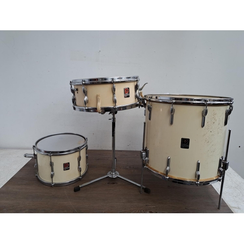 650 - A collection of vintage drum kit drums and percussion accessories to include wooden rimmed bass drum... 