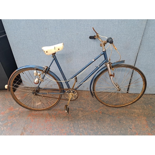 748 - A vintage blue painted town bike