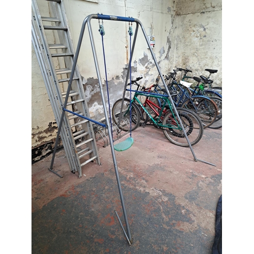 751 - A tubular metal garden swing - approx. 182cm high x 142cm wide