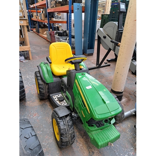 754 - A John Deere Ground Force electric ride on tractor