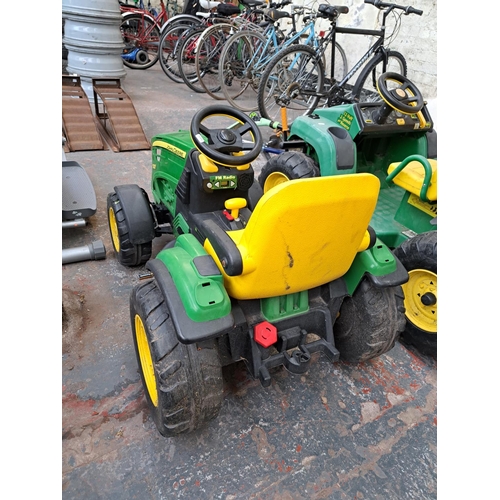 754 - A John Deere Ground Force electric ride on tractor