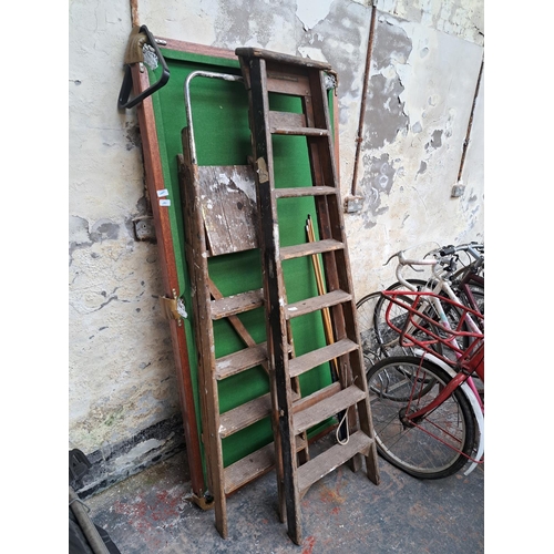 764 - Two pairs of wooden step ladders, one being Youngman Challenger