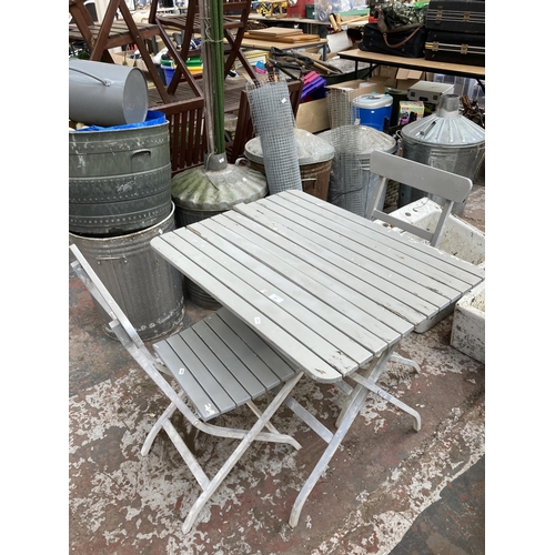 871 - A three piece grey painted patio table and chair set comprising two chairs and table - approx. 74cm ... 