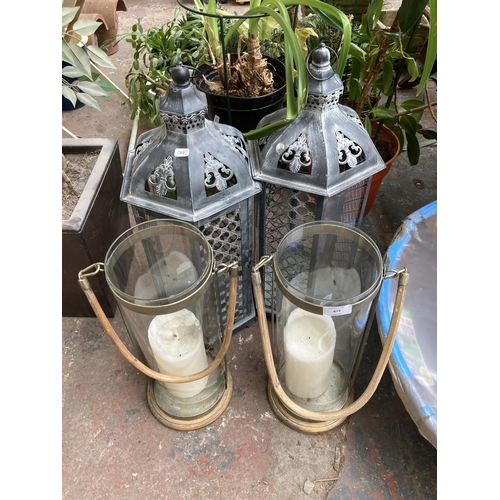 875 - Two pairs of outdoor hanging lanterns - largest approx. 65cm high