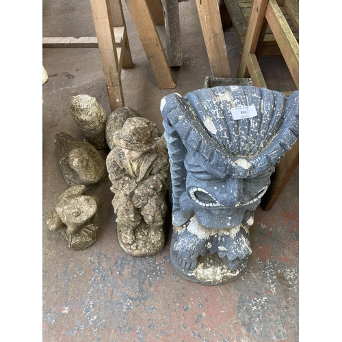 885 - Eleven cast stone and fibreglass garden ornaments and planters