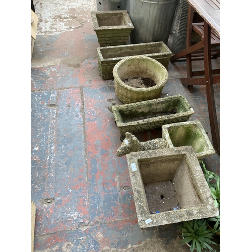 887 - Seven cast stone garden planters and ornament