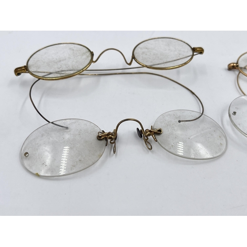 2270 - Four pairs of late 19th/early 20th century yellow metal pince-nez spectacles