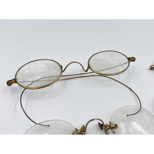 2270 - Four pairs of late 19th/early 20th century yellow metal pince-nez spectacles