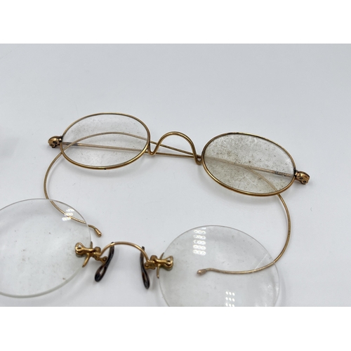 2270 - Four pairs of late 19th/early 20th century yellow metal pince-nez spectacles