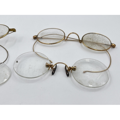 2270 - Four pairs of late 19th/early 20th century yellow metal pince-nez spectacles