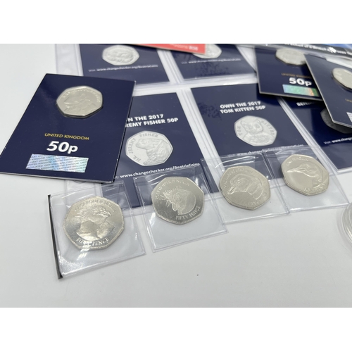 2293 - A collection of British commemorative coins to include Pobjoy Mint Climate Change £1 coin, The Royal... 