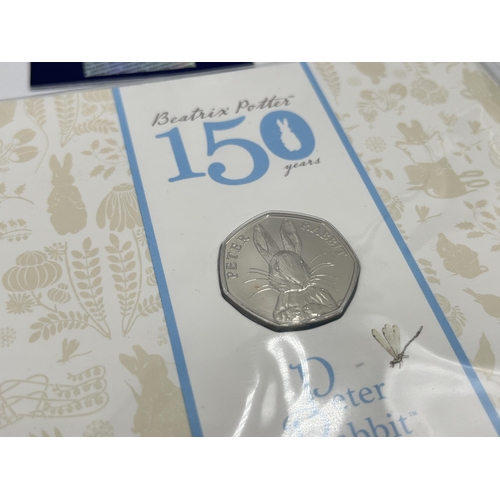 2293 - A collection of British commemorative coins to include Pobjoy Mint Climate Change £1 coin, The Royal... 