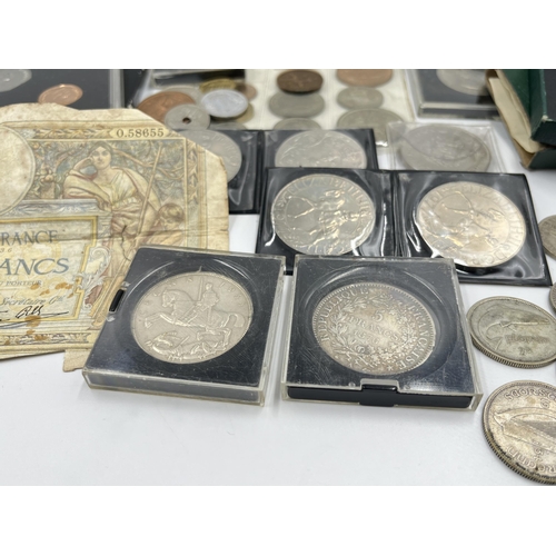 2294 - A collection of worldwide coins and bank notes to include 1876 silver five francs, 1941 United State... 