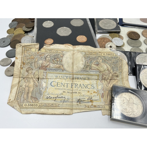 2294 - A collection of worldwide coins and bank notes to include 1876 silver five francs, 1941 United State... 