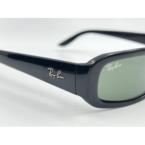 2295 - A cased pair of Ray-Ban RB2127 sunglasses