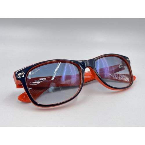 2296 - A cased pair of Ray-Ban New Wayfarer Luxottica sunglasses