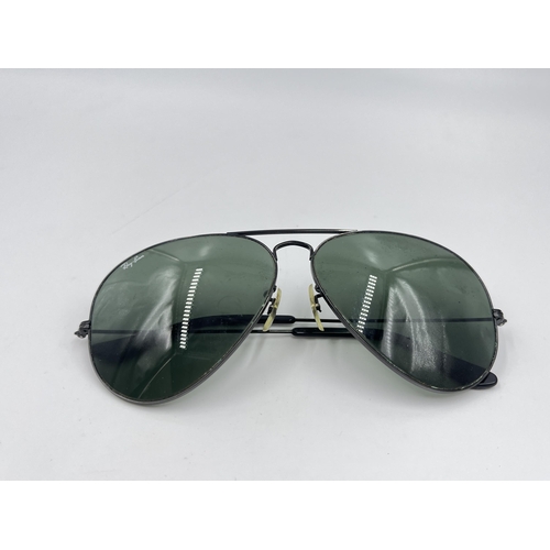 2297 - A cased pair of Ray-Ban Aviator sunglasses