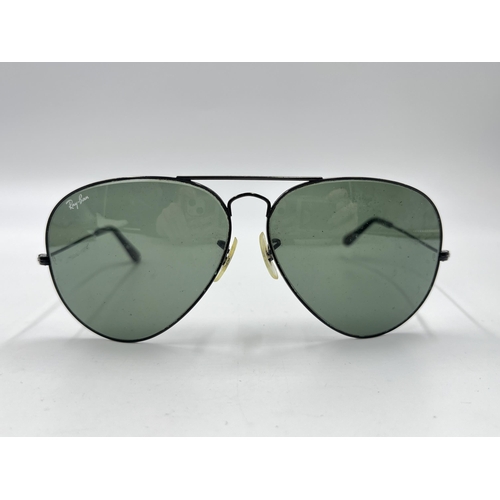 2297 - A cased pair of Ray-Ban Aviator sunglasses